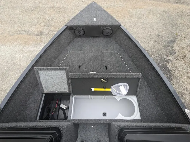 Slide: The Image of 2025 Lund 1650 Angler boat interior with storage compartments and fishing gear. - 5