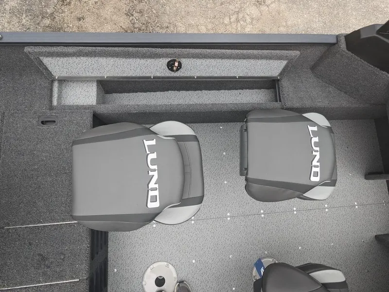 Slide: The Image of 2025 Lund 1650 Angler boat interior with two gray seats. - 6