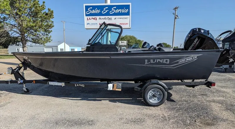 Slide: The Image of 2025 Lund 1650 Angler boat on trailer at sales and service center. - 8