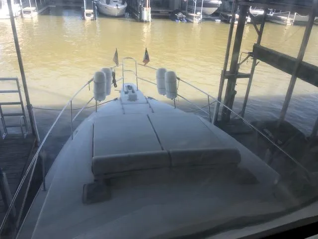 Slide: The Image of 1983 Sea Ray 390 Sport Fisherman docked at a marina. - 13