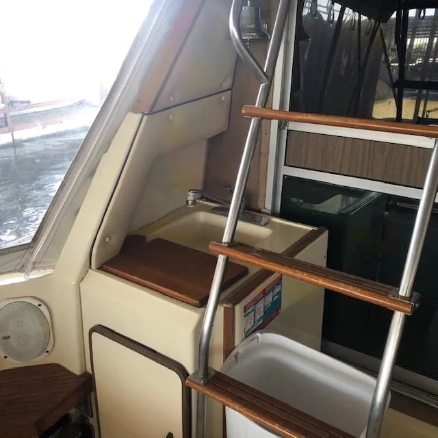 Slide: The Image of Interior of 1983 Sea Ray 390 Sport Fisherman with ladder and sink. - 5