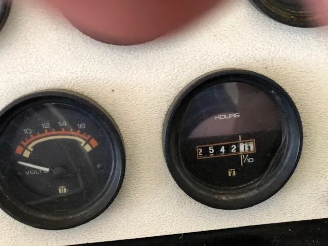 Slide: The Image of Close-up of 1983 Sea Ray 390 Sport Fisherman boat gauges showing voltage and engine hours. - 7