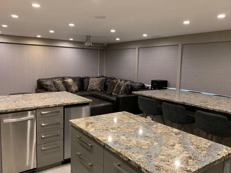 Slide: The Image of Modern kitchen with granite countertops, island, and cozy seating area in Adonia Rhapsody Share #11, 2019. - 16