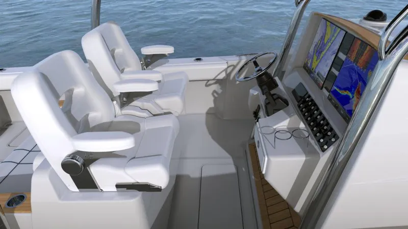 Slide: The Image of 2024 Southport 33 FE boat cockpit with dual white captain chairs and advanced navigation system. - 4