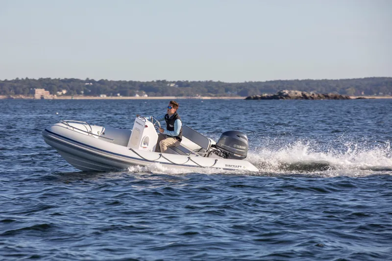 The Image of 2024 Ribcraft 4.8T inflatable boat cruising on open water. - 0