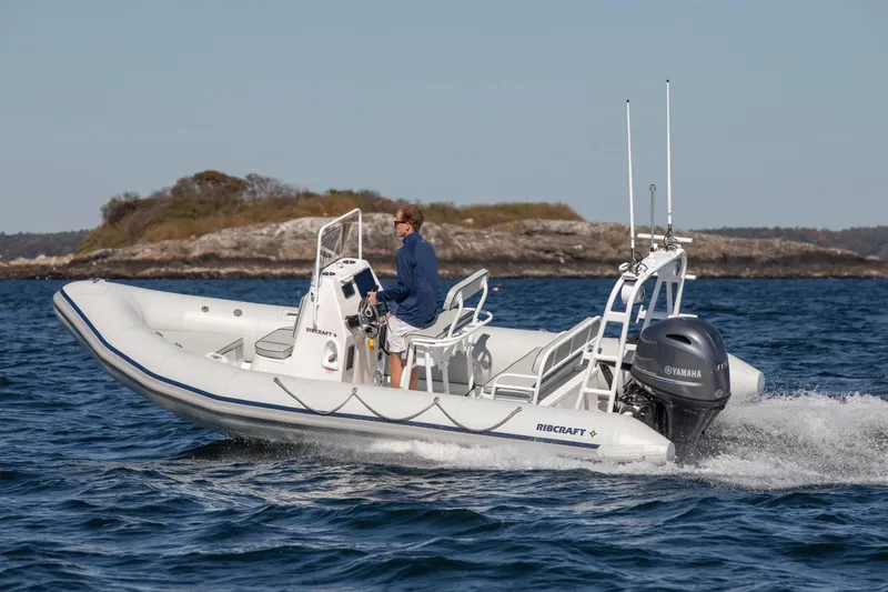 Slide: The Image of 2024 Ribcraft 5.85 boat cruising on open water. - 1