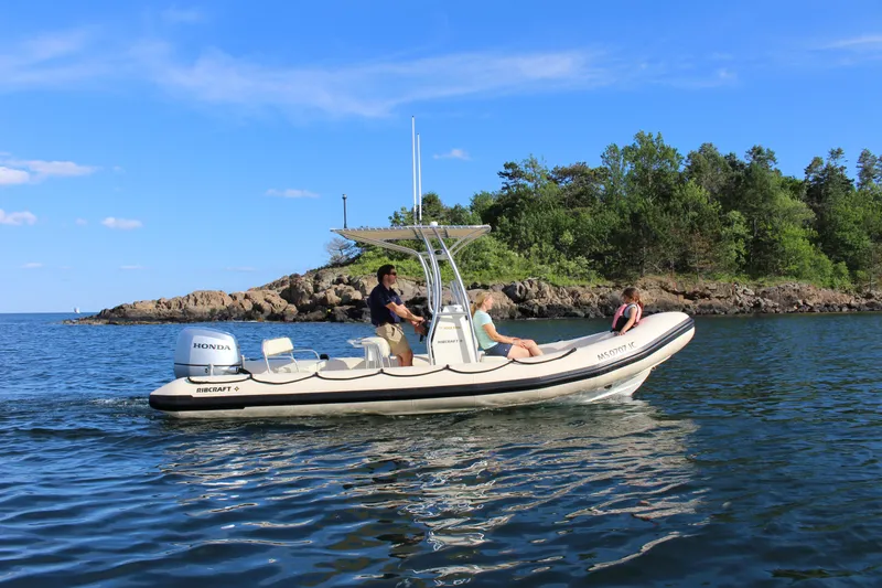 The Image of 2024 Ribcraft 6.5 boat cruising on a lake with passengers. - 0