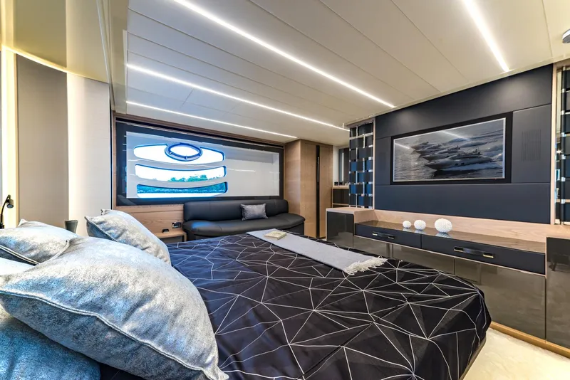 Slide: The Image of Luxurious bedroom interior of 2018 Pershing 70 yacht with modern decor and ambient lighting. - 11