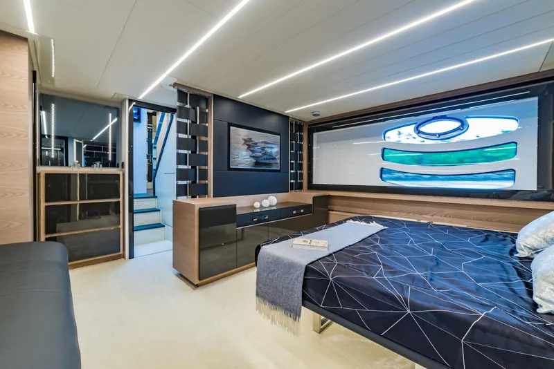 Slide: The Image of Luxurious bedroom interior of 2018 Pershing 70 yacht with modern design and large window. - 12