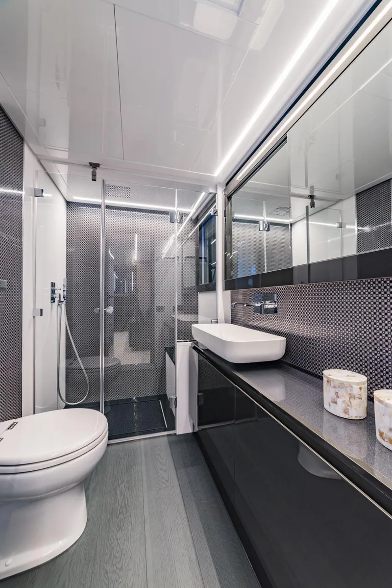 Slide: The Image of Modern bathroom in a 2018 Pershing 70 yacht with sleek design and luxury fixtures. - 13