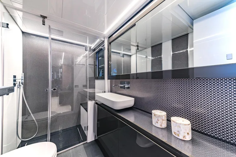 Slide: The Image of Modern bathroom in 2018 Pershing 70 yacht with sleek design and glass shower. - 14