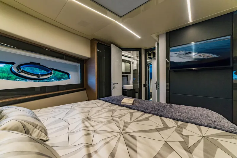 Slide: The Image of Luxurious bedroom interior of 2018 Pershing 70 yacht with modern design and ocean view. - 17