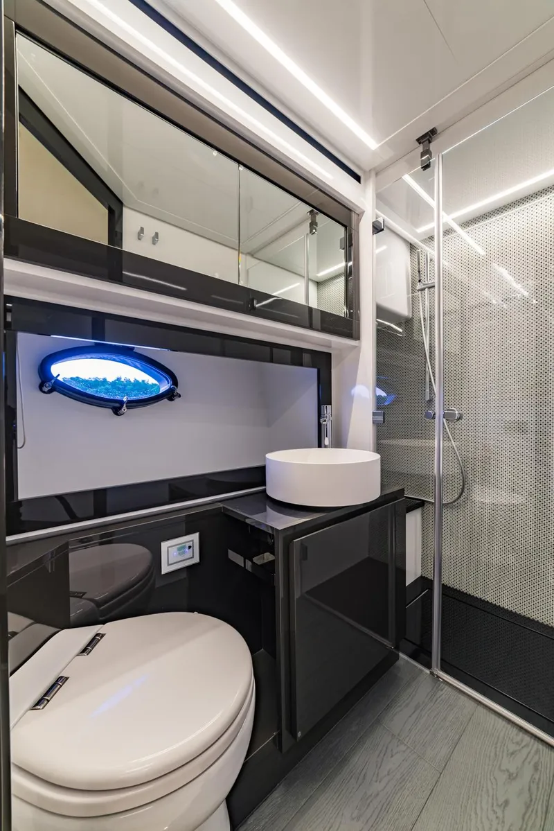 Slide: The Image of Modern bathroom in 2018 Pershing 70 yacht with sleek design and glass shower. - 18