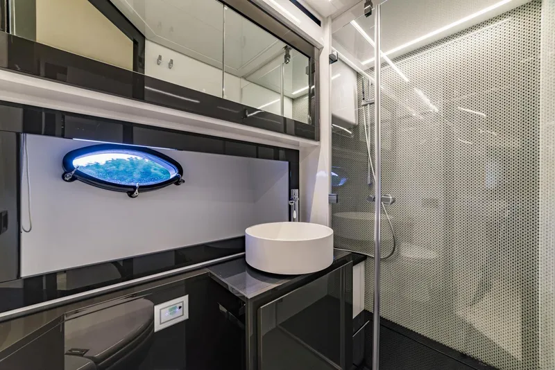 Slide: The Image of Modern bathroom in 2018 Pershing 70 yacht with sleek design and round sink. - 19