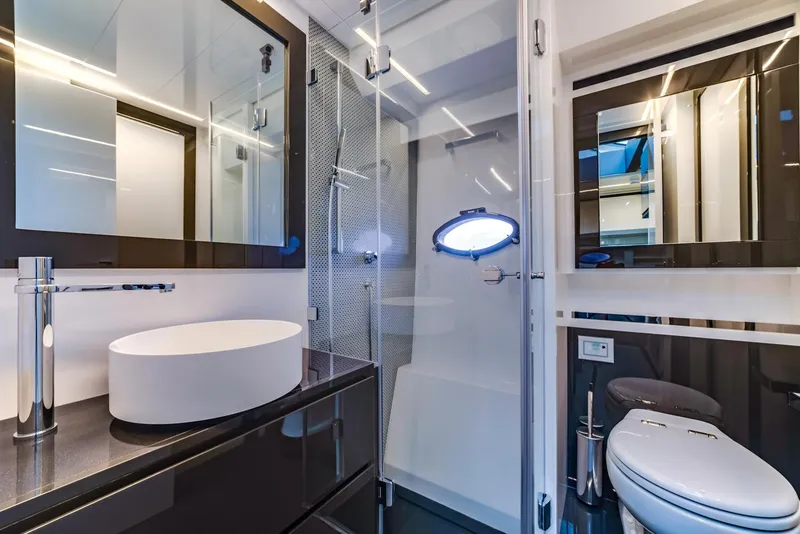 Slide: The Image of Modern bathroom in 2018 Pershing 70 yacht with sleek fixtures and glass shower. - 22