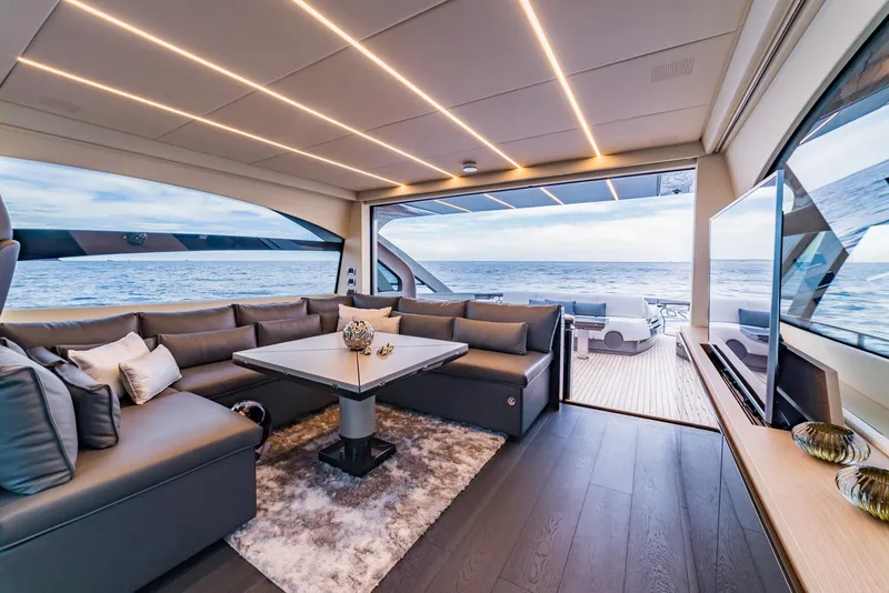 Slide: The Image of Luxurious interior of 2018 Pershing 70 yacht with ocean view, modern seating, and elegant decor. - 7