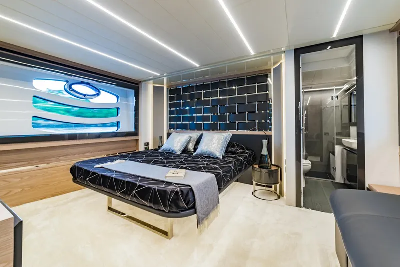 Slide: The Image of Luxurious bedroom interior of 2018 Pershing 70 yacht with modern design and ensuite bathroom. - 9