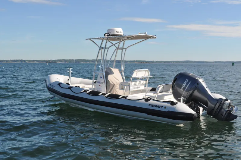 Slide: The Image of 2024 Ribcraft 6.8 boat on open water with Yamaha outboard motor. - 1