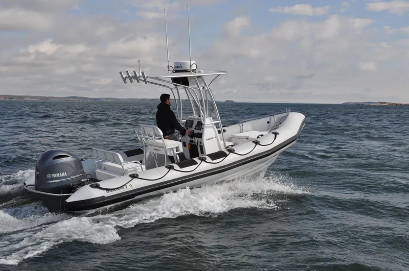 Slide: The Image of 2024 Ribcraft 6.8 boat cruising on open water. - 2