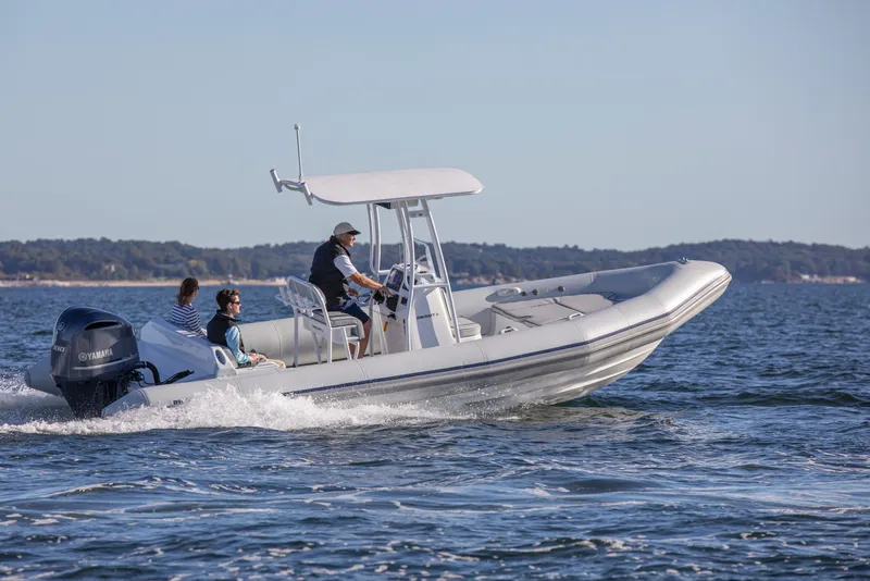 Slide: The Image of 2024 Ribcraft 7.8 boat cruising on open water with passengers. - 3