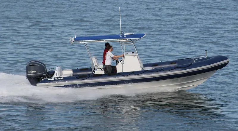 Slide: The Image of 2024 Ribcraft 9.0 boat cruising on water with a person at the helm. - 3