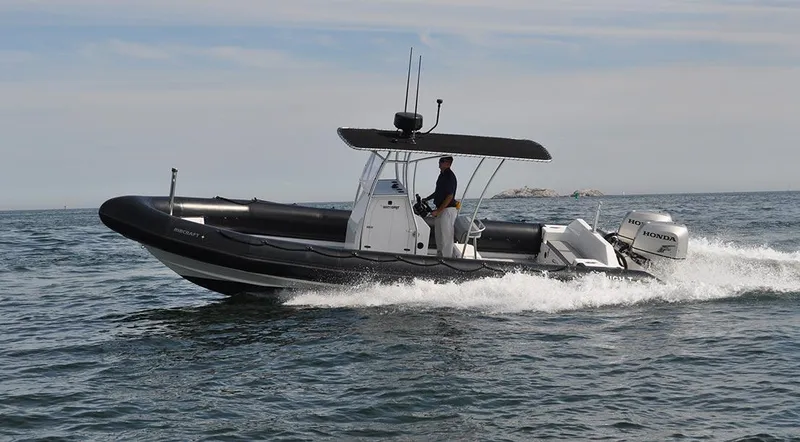 Slide: The Image of 2024 Ribcraft 9.0 boat cruising on open water. - 4