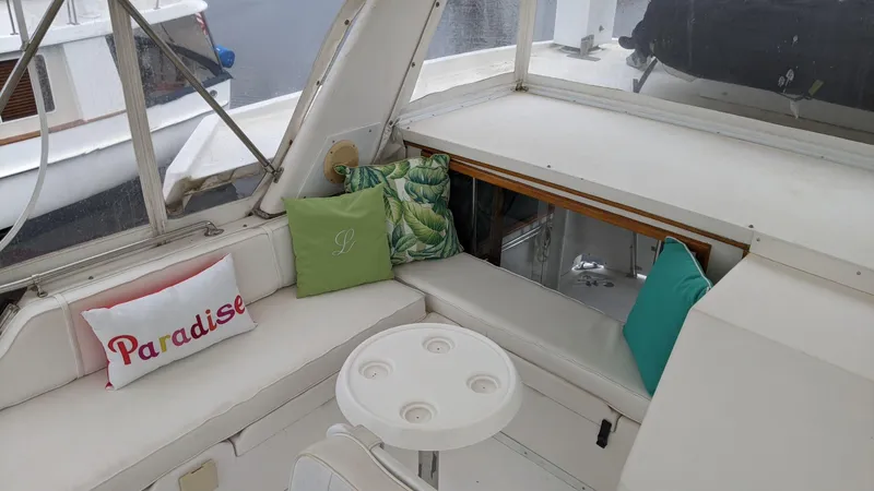 Slide: The Image of Interior of 1992 Jefferson 43 Sun Deck yacht with cushions and table. - 10
