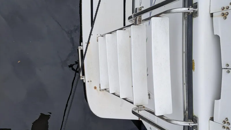 Slide: The Image of 1992 Jefferson 43 Sun Deck boat ladder view - 13