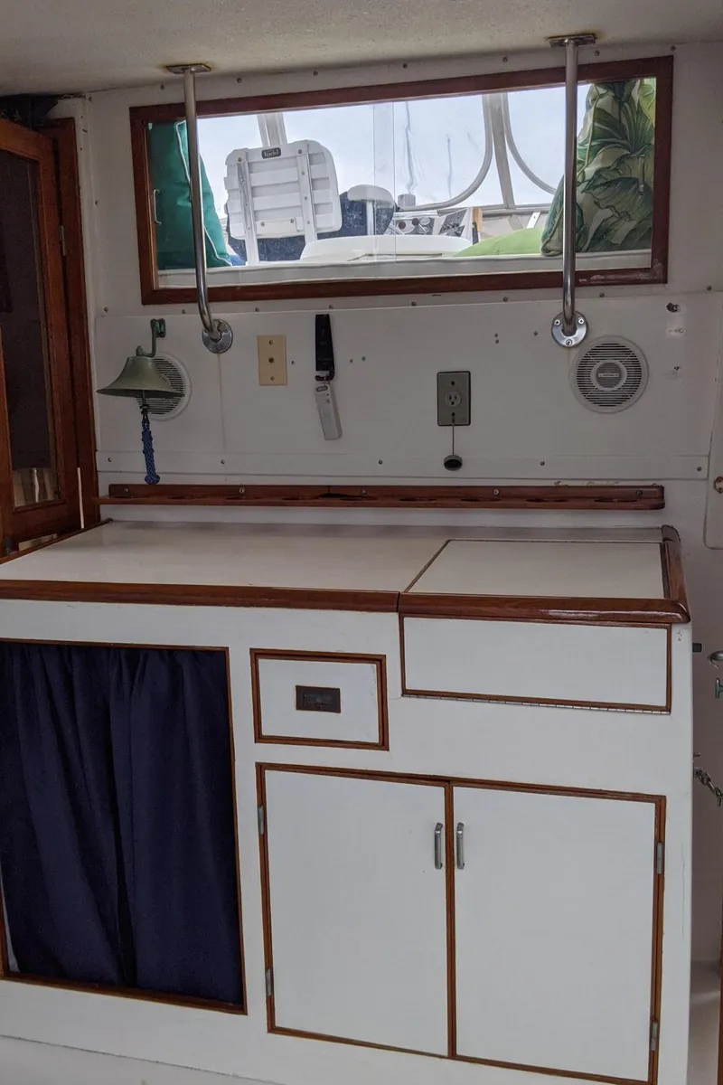 Slide: The Image of Interior of 1992 Jefferson 43 Sun Deck yacht with cabinets. - 18