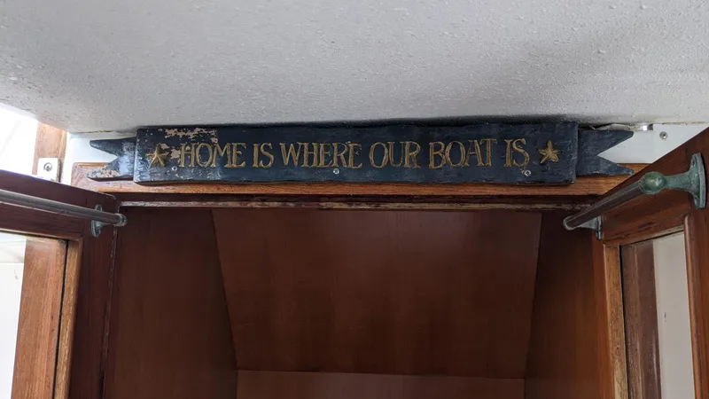 Slide: The Image of Sign on 1992 Jefferson 43 Sun Deck: "Home is where our boat is." - 19