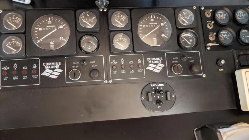 Slide: The Image of Dashboard of a 1992 Jefferson 43 Sun Deck boat. - 23