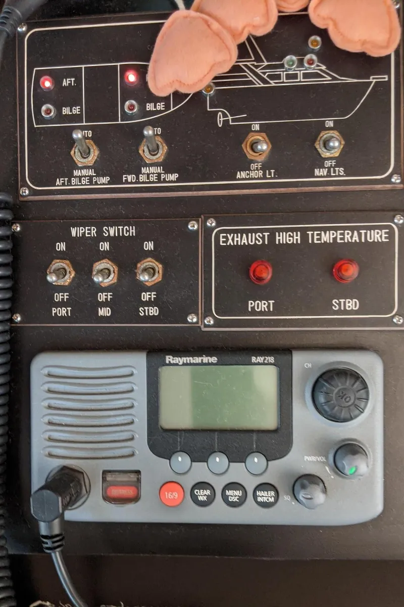 Slide: The Image of 1992 Jefferson 43 Sun Deck control panel with Raymarine device. - 25