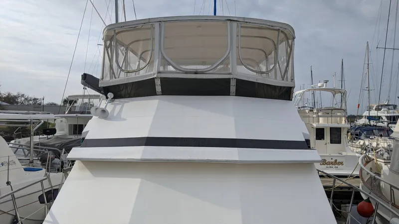 Slide: The Image of 1992 Jefferson 43 Sun Deck yacht in harbor. - 3