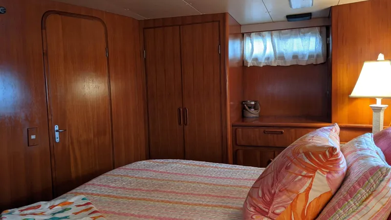 Slide: The Image of Interior of a 1992 Jefferson 43 Sun Deck yacht with wooden furnishings. - 45