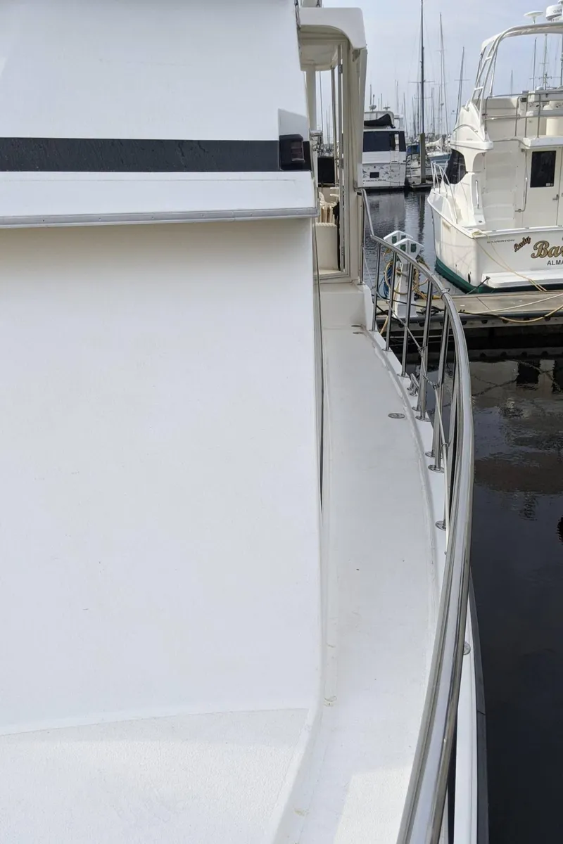 Slide: The Image of 1992 Jefferson 43 Sun Deck yacht docked at marina. - 5