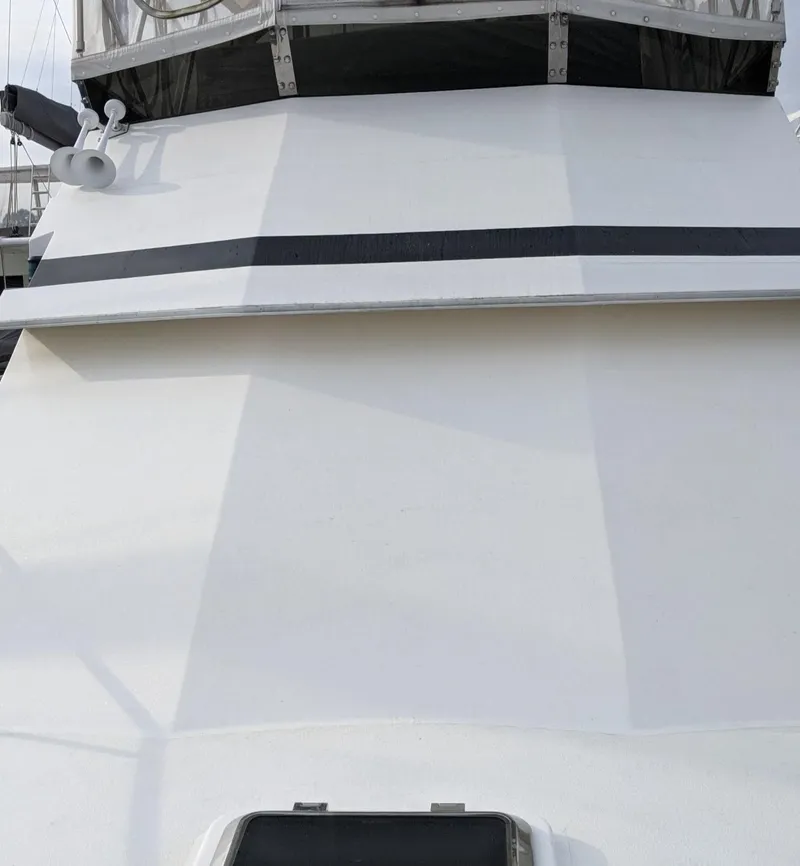 Slide: The Image of Front view of 1992 Jefferson 43 Sun Deck yacht. - 6