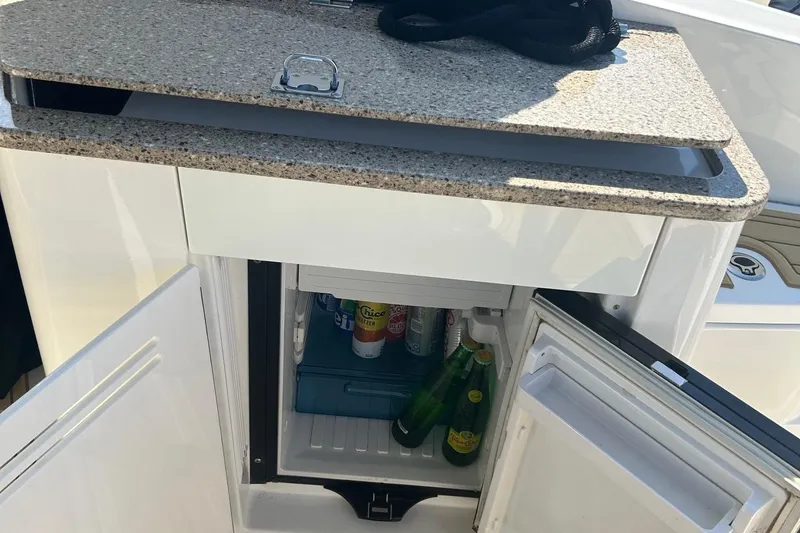 Slide: The Image of Mini fridge on 2015 Sea Ray 350 Sundancer yacht with drinks inside. - 6