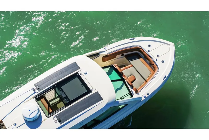 Slide: The Image of 2023 Scout 350 LXZ boat on green water, top view. - 10