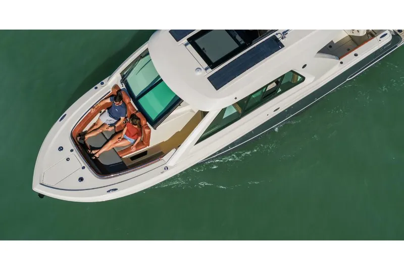 Slide: The Image of 2023 Scout 350 LXZ luxury boat cruising with passengers. - 11