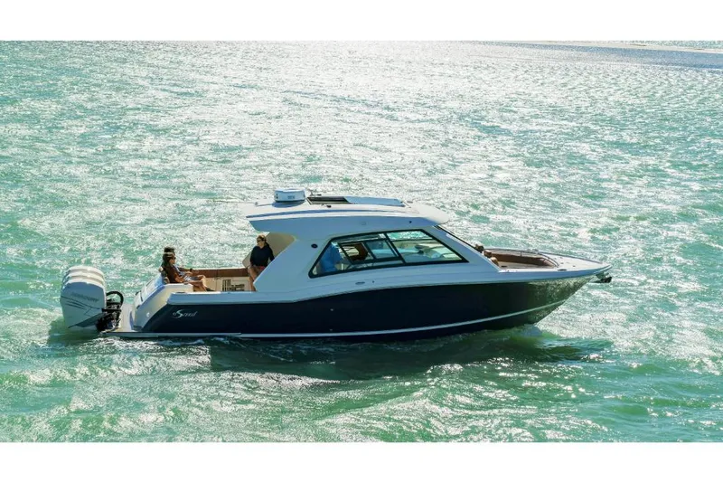 Slide: The Image of 2023 Scout 350 LXZ boat cruising on a sunny, calm sea. - 19