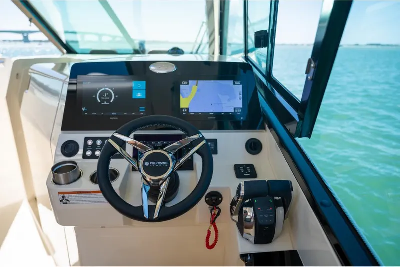 Slide: The Image of 2023 Scout 350 LXZ boat helm with modern navigation and control systems. - 34