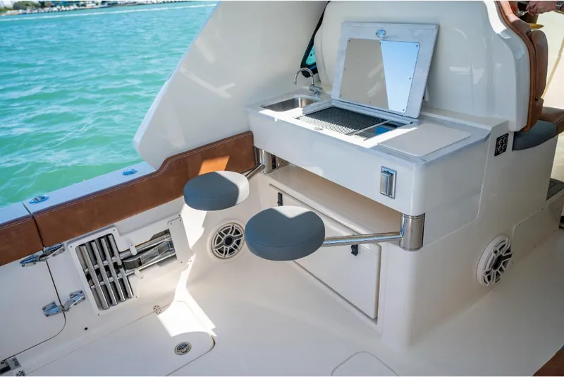 Slide: The Image of 2023 Scout 350 LXZ boat interior with seating and storage. - 37