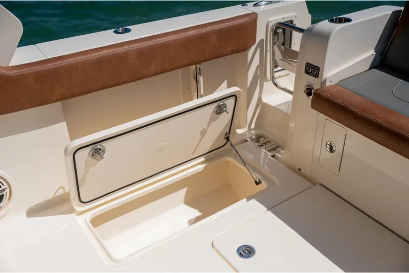 Slide: The Image of 2023 Scout 350 LXZ boat interior storage compartment. - 41