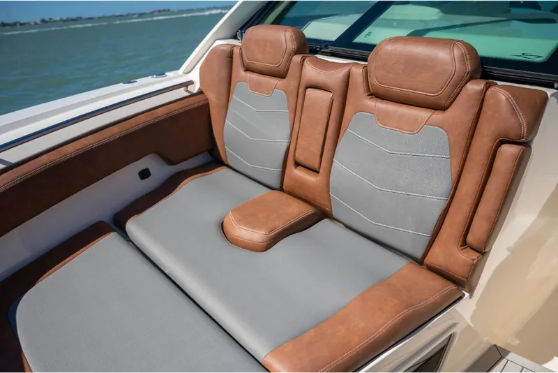 Slide: The Image of Luxurious seating on the 2023 Scout 350 LXZ boat with brown and gray upholstery. - 46