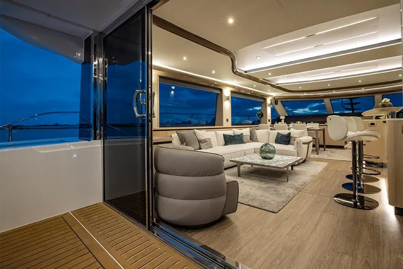 Slide: The Image of Luxurious interior of the 2023 Aquila 70 Luxury yacht with modern furnishings and ambient lighting. - 15