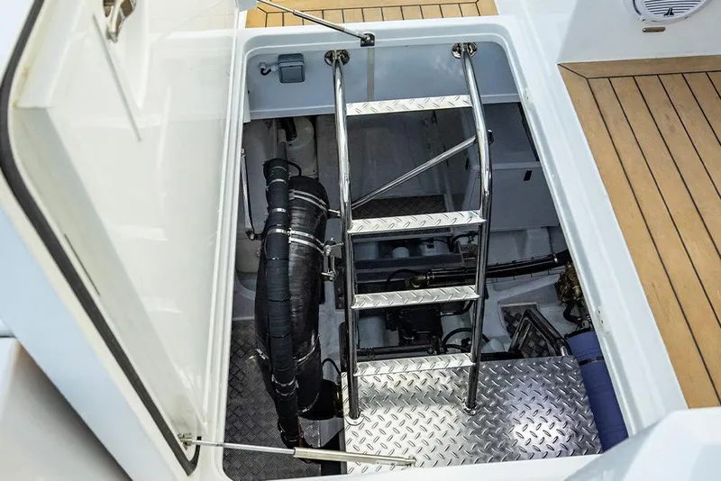 Slide: The Image of Engine room access hatch with ladder on 2023 Aquila 70 Luxury yacht. - 25