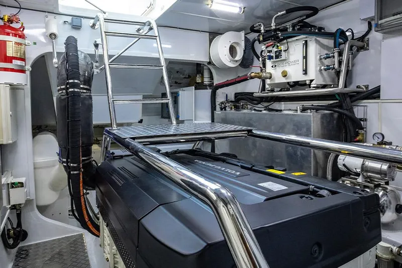 Slide: The Image of Engine room of 2023 Aquila 70 Luxury yacht with modern equipment and ladder. - 26