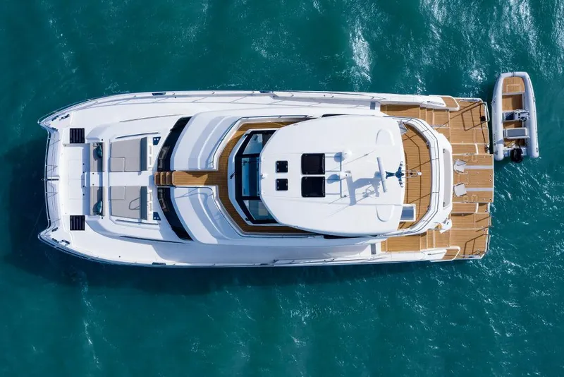 Slide: The Image of Aerial view of 2023 Aquila 70 Luxury yacht on the water. - 4
