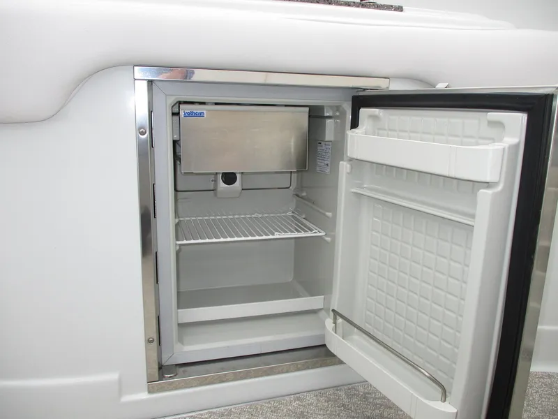 Slide: The Image of Open refrigerator in a 2015 Crownline 285 SS yacht. - 14