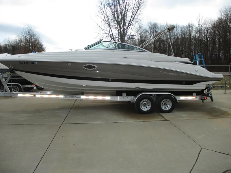 Slide: The Image of 2015 Crownline 285 SS boat on trailer, side view. - 2